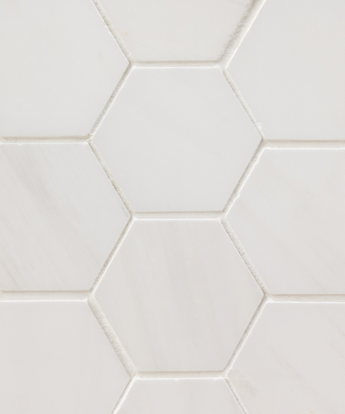 A white hexagonal tile pattern with a white background