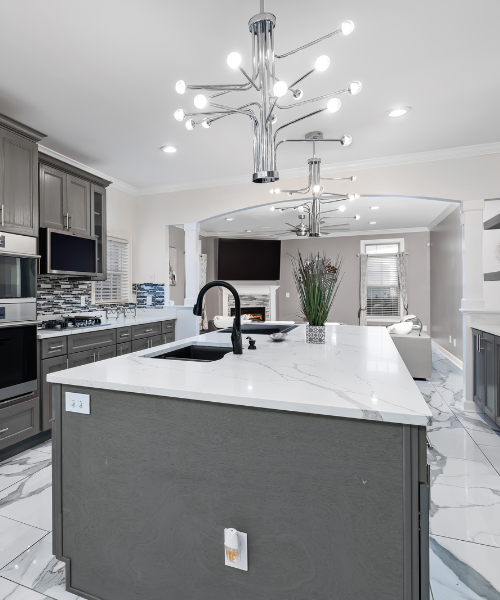 A kitchen with a center island and a sink