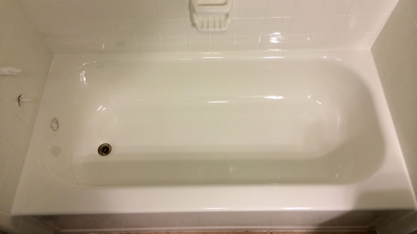 A white bath tub sitting inside of a bathroom