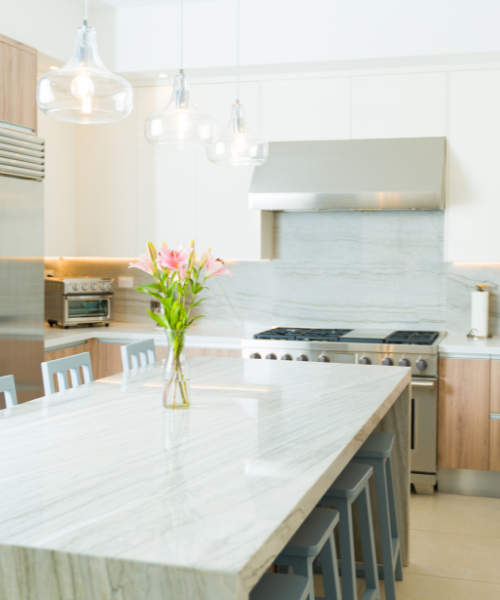 Kitchen with a marble countertop and stainless appliances