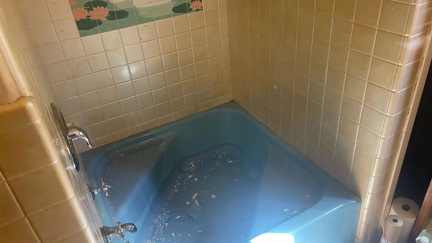 Blue bathtub inside a bathroom
