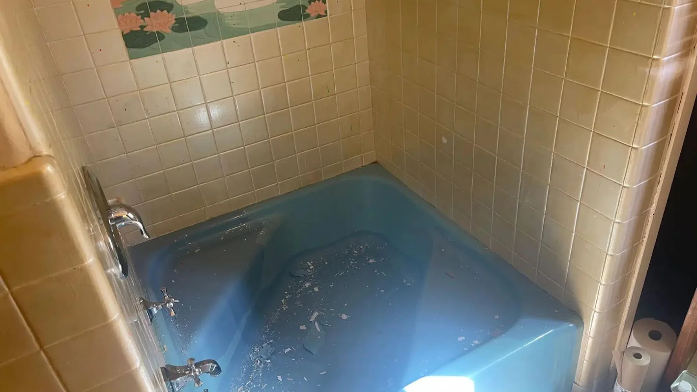 Blue bathtub inside a bathroom