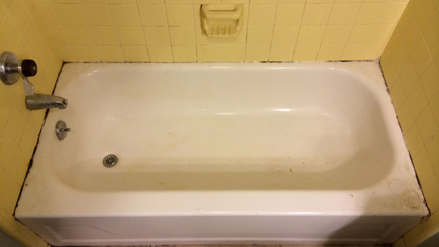 Bathtub surface before repair and refinishing
